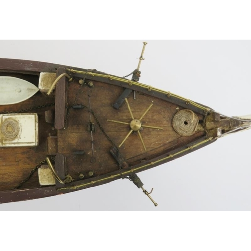 191 - Maritime: A vintage model of the Cutty Sark clipper ship. Hand crafted and painted wood. Molded plas... 