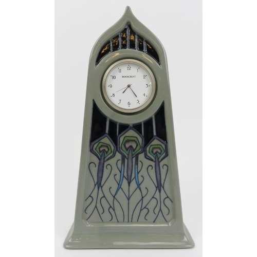 198 - A Moorcroft Peacock Parade pattern clock. 5 in (12.6 cm) height, 9 in (22.8 cm) width. 
Condition re... 