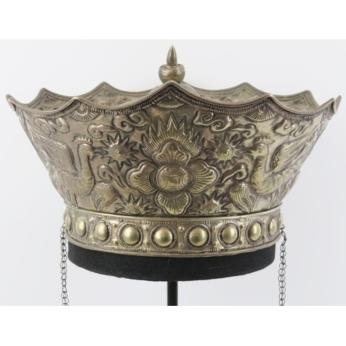 199 - A Chinese parcel gilt silver ceremonial crown, 19th century. Embossed with a central flaming pearl f... 