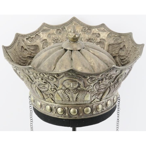 199 - A Chinese parcel gilt silver ceremonial crown, 19th century. Embossed with a central flaming pearl f... 