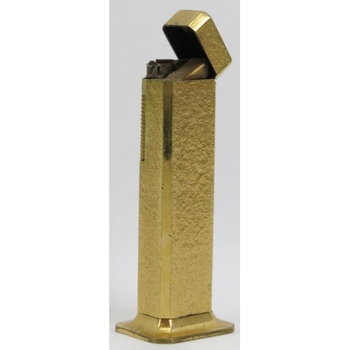 201 - A vintage Dunhill gold plated Tallboy table lighter. Of rectangular form with a flared foot. 4.3 in ... 