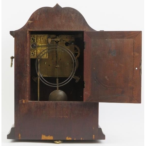 203 - An Edwardian mahogany inlaid mantle clock. With a marquetry inlaid mahogany case, circular bevelled ... 