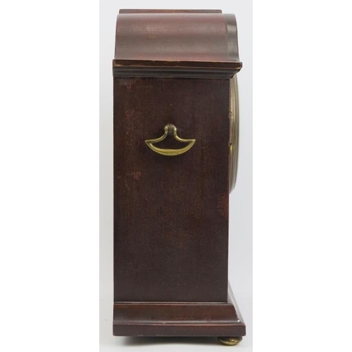 203 - An Edwardian mahogany inlaid mantle clock. With a marquetry inlaid mahogany case, circular bevelled ... 