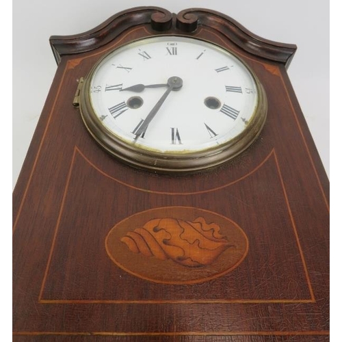 203 - An Edwardian mahogany inlaid mantle clock. With a marquetry inlaid mahogany case, circular bevelled ... 