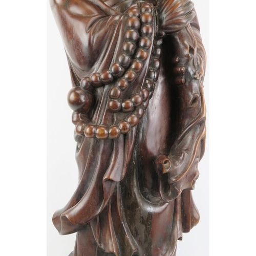 21 - A Chinese carved wood figure of an immortal, 20th century. 37 in (94 cm) height. 
Condition report: ... 