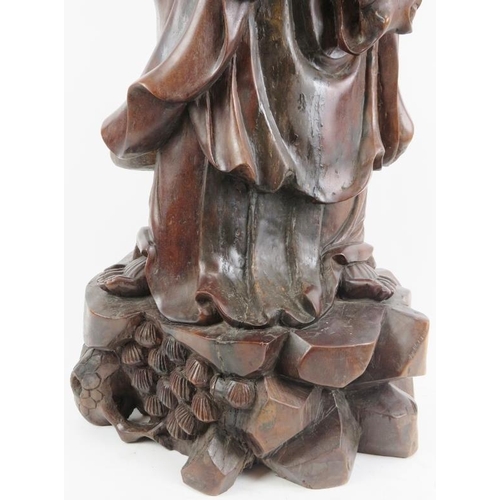 21 - A Chinese carved wood figure of an immortal, 20th century. 37 in (94 cm) height. 
Condition report: ... 