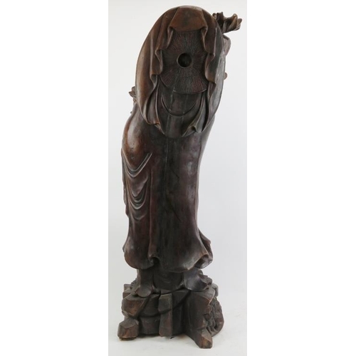 21 - A Chinese carved wood figure of an immortal, 20th century. 37 in (94 cm) height. 
Condition report: ... 