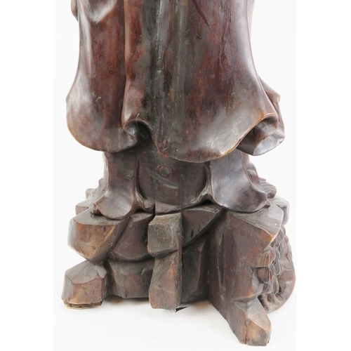 21 - A Chinese carved wood figure of an immortal, 20th century. 37 in (94 cm) height. 
Condition report: ... 