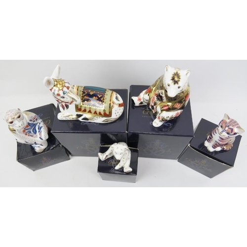 211 - A group of five Royal Crown Derby porcelain paperweight figurines. Comprising a Donkey, Barbary Maca... 