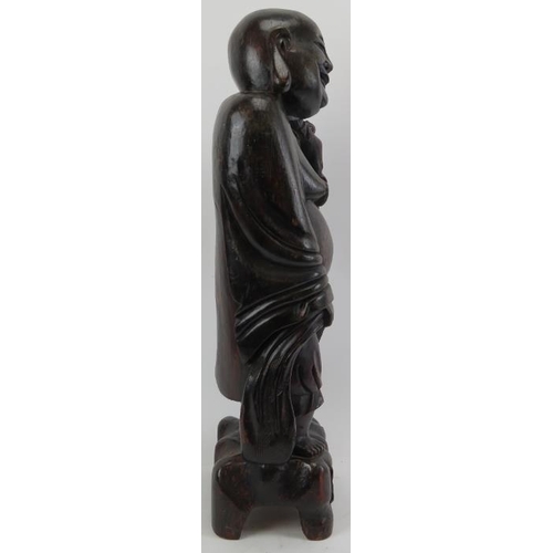 213 - A large Chinese carved wood figure of Laughing Buddha, 20th century. 24 in (61 cm) height. 
Conditio... 