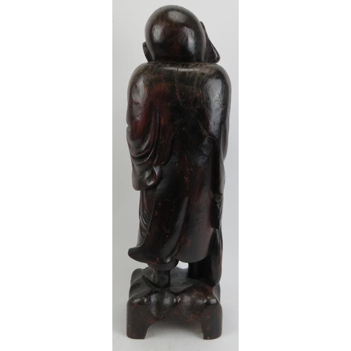 213 - A large Chinese carved wood figure of Laughing Buddha, 20th century. 24 in (61 cm) height. 
Conditio... 