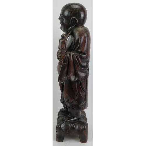 213 - A large Chinese carved wood figure of Laughing Buddha, 20th century. 24 in (61 cm) height. 
Conditio... 