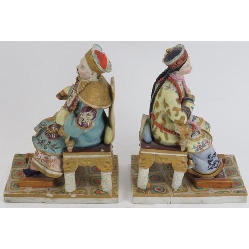 219 - A pair of European porcelain figures depicting a Chinese emperor and empress, late 19th/early 20th c... 