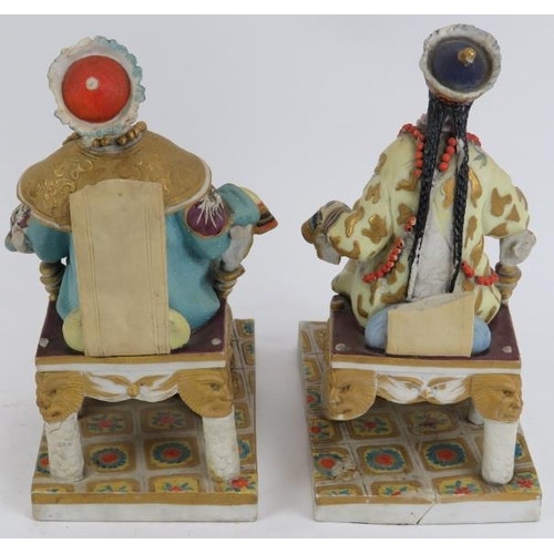 219 - A pair of European porcelain figures depicting a Chinese emperor and empress, late 19th/early 20th c... 