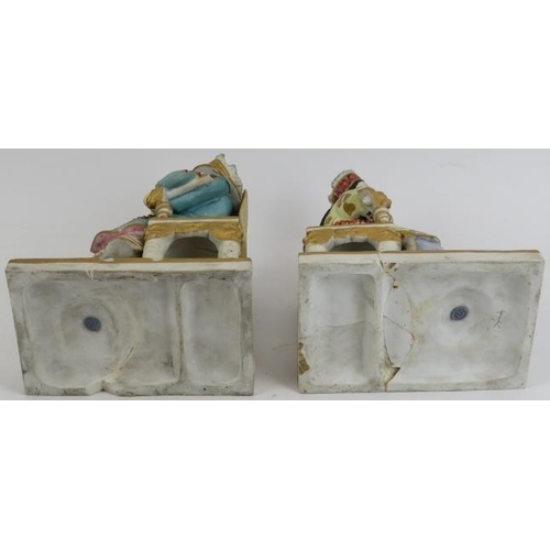 219 - A pair of European porcelain figures depicting a Chinese emperor and empress, late 19th/early 20th c... 