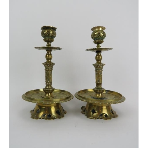 250 - A pair of Victorian brass candlesticks, 19th/early 20th century. Of a typical overall Dutch form wit... 