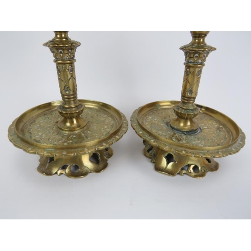 250 - A pair of Victorian brass candlesticks, 19th/early 20th century. Of a typical overall Dutch form wit... 