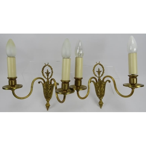 256 - A pair of Neo Classical revival cast gilt-metal twin-branch wall lights. 9.1 in (23 cm) height. 
Con... 