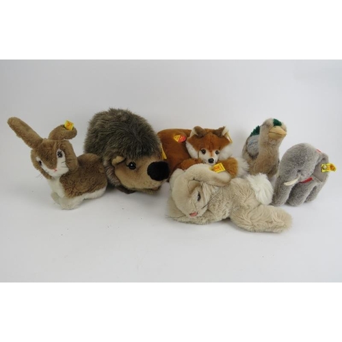 264 - A group of Steiff stuffed toys. Comprising a fox, hedgehog, elephant, duck and two bunnies each with... 