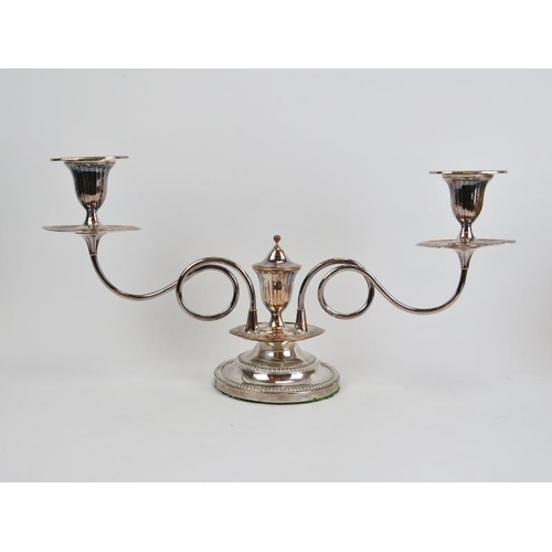 270 - An electroplated silver two branch candelabra, 19th century. With tendril stems. Detachable sconces ... 