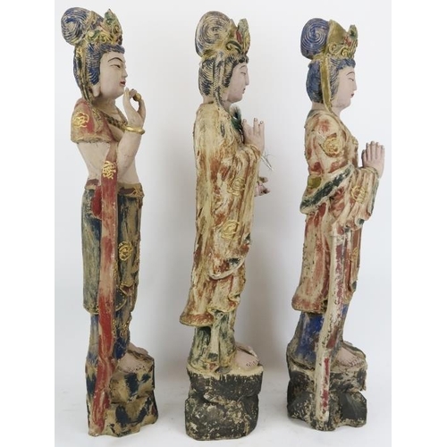 28 - Three Chinese gilt and lacquer painted carved wood figural interpretations of Guanyin, 20th century.... 