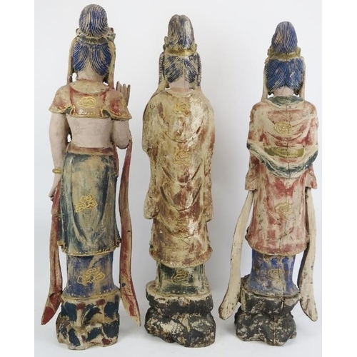 28 - Three Chinese gilt and lacquer painted carved wood figural interpretations of Guanyin, 20th century.... 