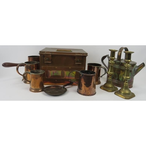 282 - A group of brass and copper items, 19th/early 20th century. Comprising four tankards, a pouring pot,... 