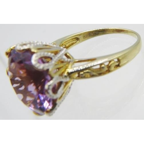 319 - An amethyst ring, high set, faceted 16mm round cut solitaire, size Q/R, 14k yellow gold overlay mark... 