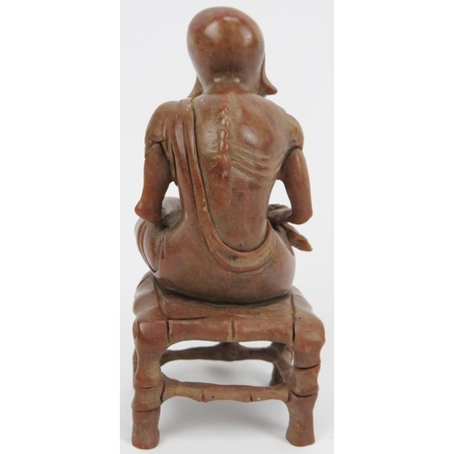 32 - A Chinese soap stone carved figure of an old man, 20th century. 4.8 in (12.2 cm) height. 
Condition ... 