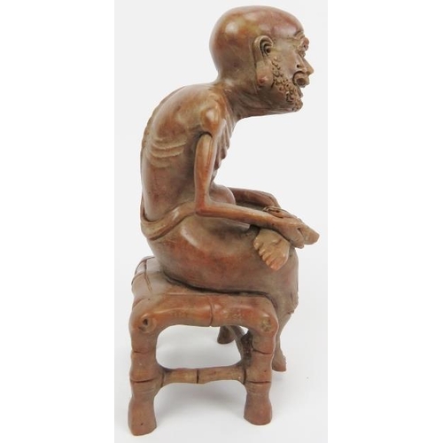 32 - A Chinese soap stone carved figure of an old man, 20th century. 4.8 in (12.2 cm) height. 
Condition ... 