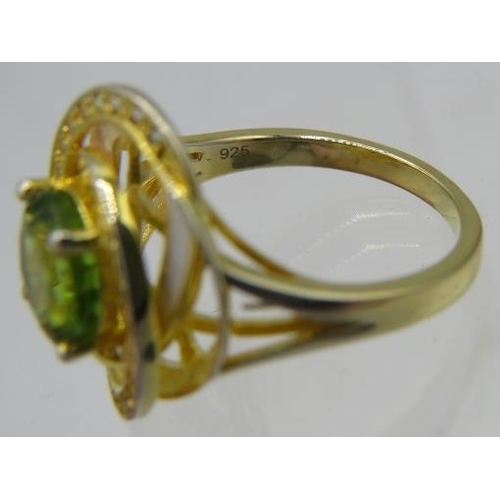 330 - Peridot ring, faceted round cut solitaire of good colour and clarity, overall face of ring 18mm, siz... 