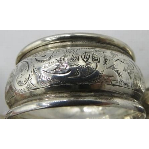 341 - A silver caddy spoon, Sheffield 1920, and three silver napkin rings, Birmingham 1891, Chester 1911. ... 