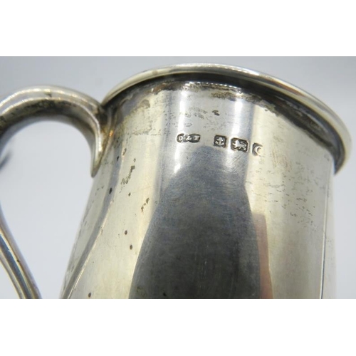 348 - A silver Christening mug on a pedestal foot, monogrammed, Birmingham 1927, approx 3 1/2