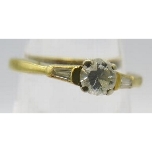 358 - An 18ctyellow gold diamond set ring, the centre diamond approx 0.5cts and baguette shoulders either ... 