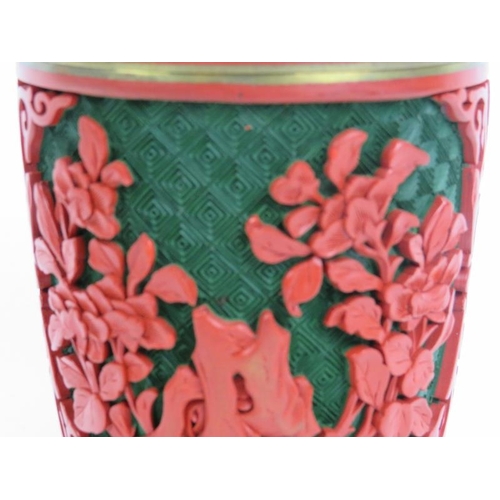 39 - A Chinese green and cinnabar lacquer jar and cover. Modelled with a lingzhu fungus finial. 5.1 in (1... 