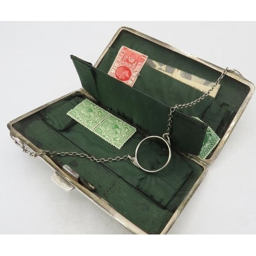 392 - A silver rectangular purse on a chain, Birmingham 1912, monogrammed, with green silk liner. Approx 5... 