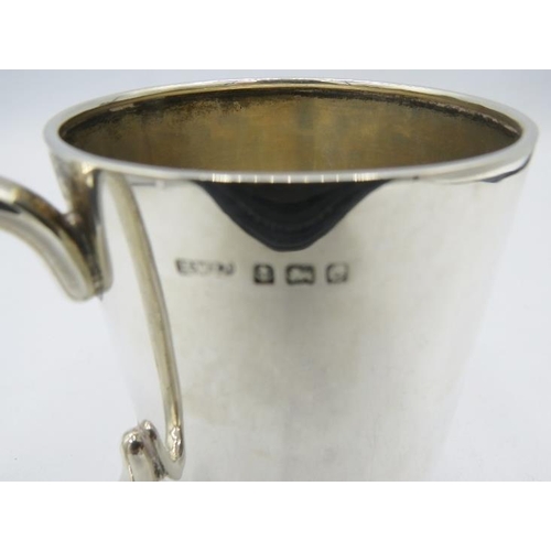 415 - A silver christening mug with pedestal foot base, engraving on side, H.W Ltd, Birmingham 1927. Appro... 