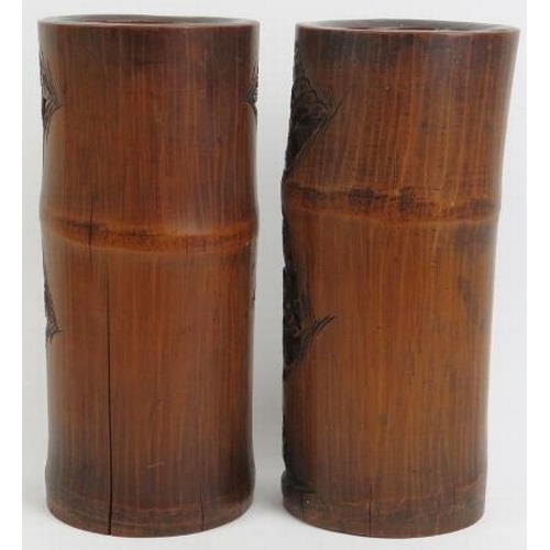 42 - A large pair of Chinese carved bamboo brush pots. Both carved depicting immortals and attendants in ... 