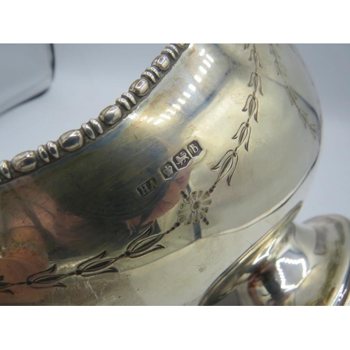 425 - An oval shaped silver pedestal bowl engraved with swags & bows, Sheffield 1919. Approx 9