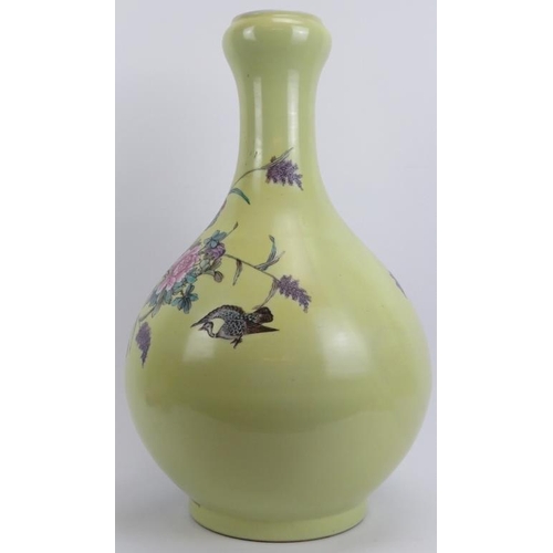 43 - A very large Chinese onion necked baluster vase, 20th century. Florally decorated with birds against... 