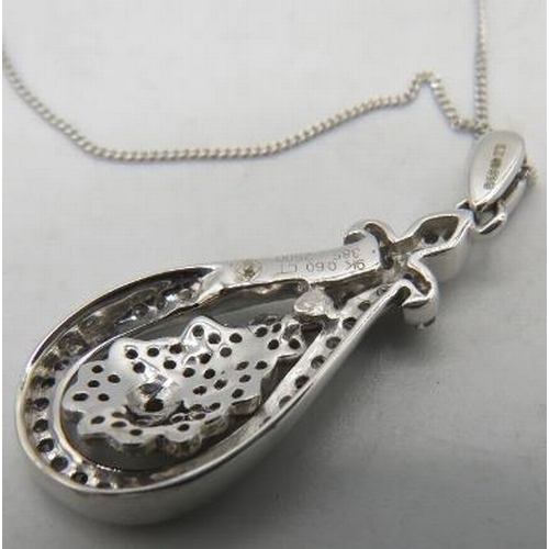 432 - A 9ct white gold pear shaped pendant encrusted with diamonds on a fine white metal chain, clasp mark... 