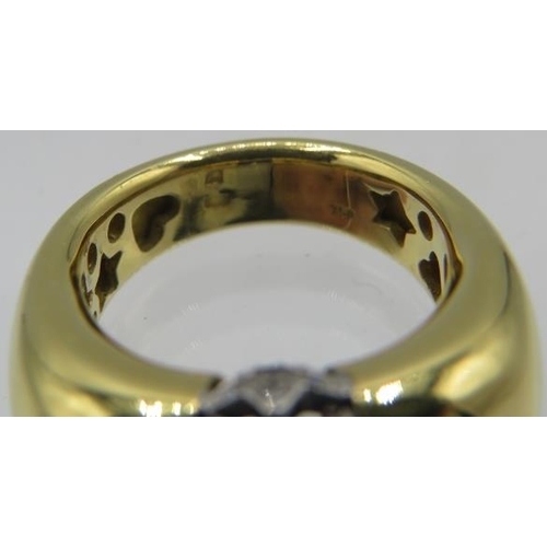 438 - A heavy 18ct yellow gold ring set with centre amethyst, approx 10mm x 8mm. To the top of the ring is... 