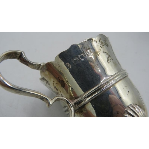 445 - A silver cream jug with wavy edge decoration and hoof feet, London 1899. Approx weight 3.3 troy oz/1... 