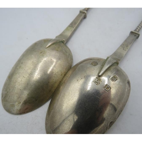 455 - A pair of Hanau pseudo silver marked apostle serving spoons, approx weight 3.2 troy oz/104 grams.
Co... 