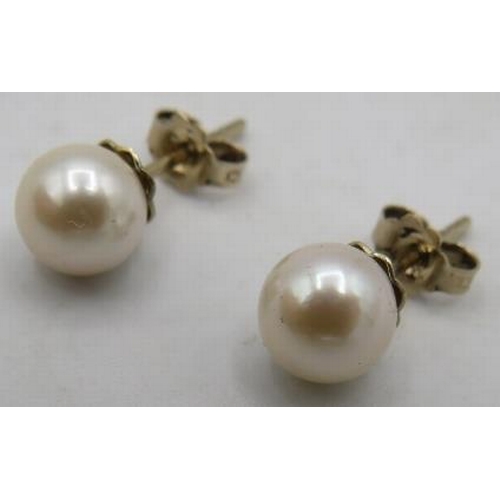 473 - A double row individually knotted pearl necklace with a sterling silver & pearl clasp, approx 17