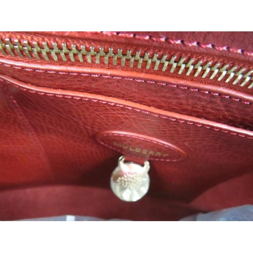 474 - A Mulberry 'Bayswater' large deep red handbag, with dust bag.
Provenance: Part of a private collecti... 