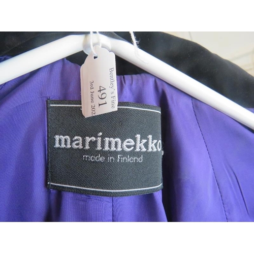 491 - A Marimekko Finnish designer black velvet opera jacket with various coloured linings.
Provenance: Pa... 