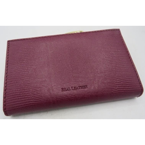 500 - Osprey, London, leather maroon wallet/purse, boxed.
Provenance: Part of a private collection of desi... 