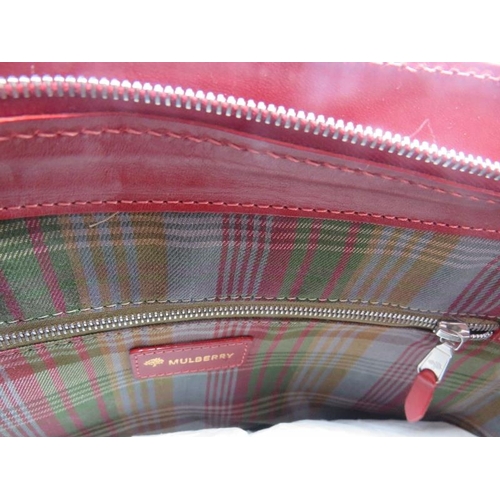 500F - A red Mulberry handbag with plaid lining, 196543.
Provenance: Part of a private collection of design... 