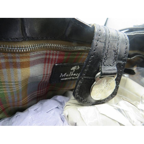 500G - A Mulberry large black handbag with original Mulberry plaid lining, 039356.
Provenance: Part of a pr... 